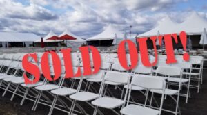 Empty chairs with the words"Sold Out"   placed over in red